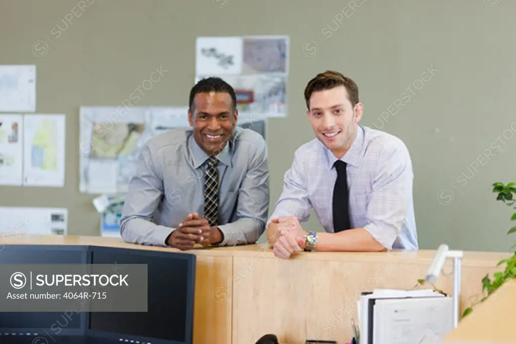 Male co-workers hanging out at office