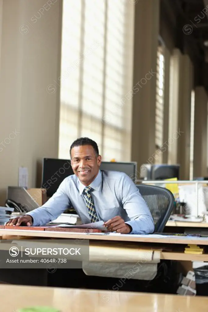 Businessman at desk in office