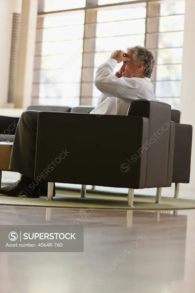 Businessman waiting in office lobby