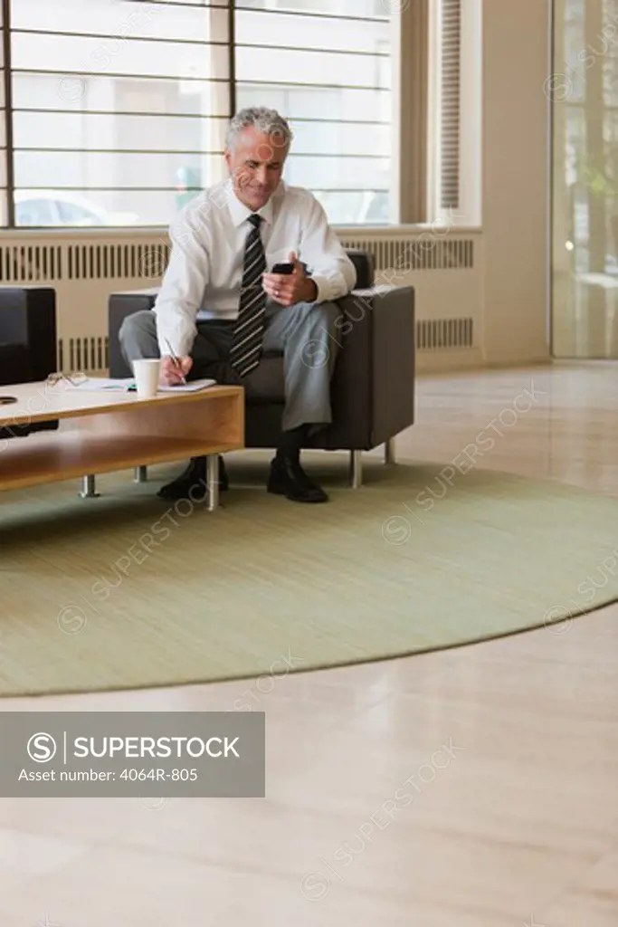 Business executive waiting in office lobby