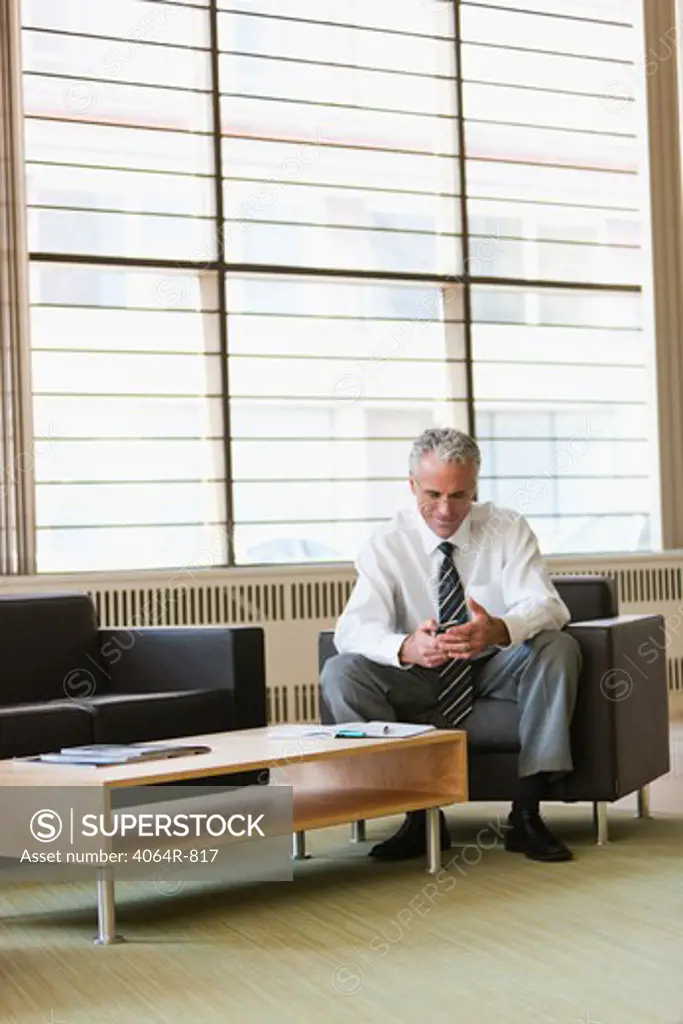 Business executive waiting in office lobby
