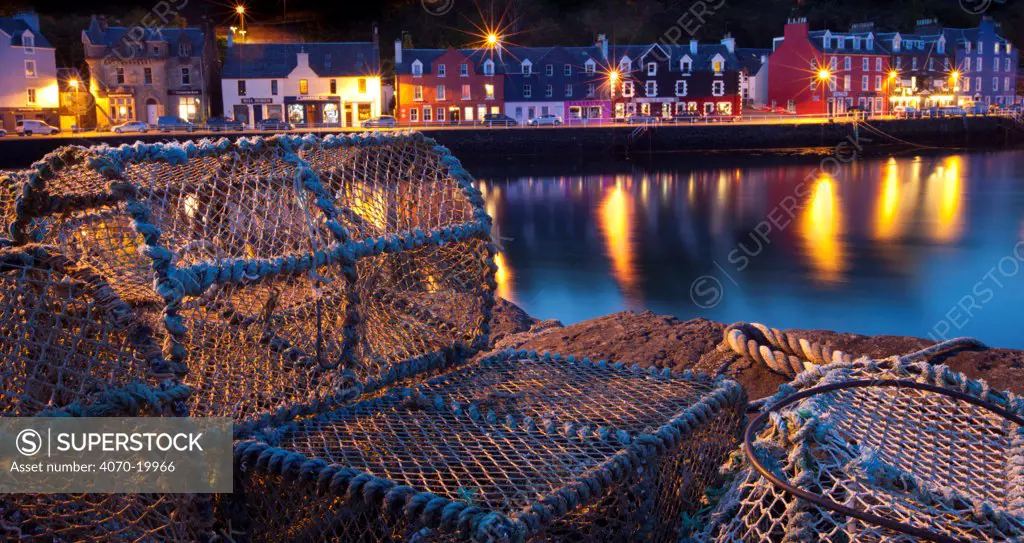 Lobster pots on harbourside at night, Tobermory harbour, Isle of Mull, Scotland.