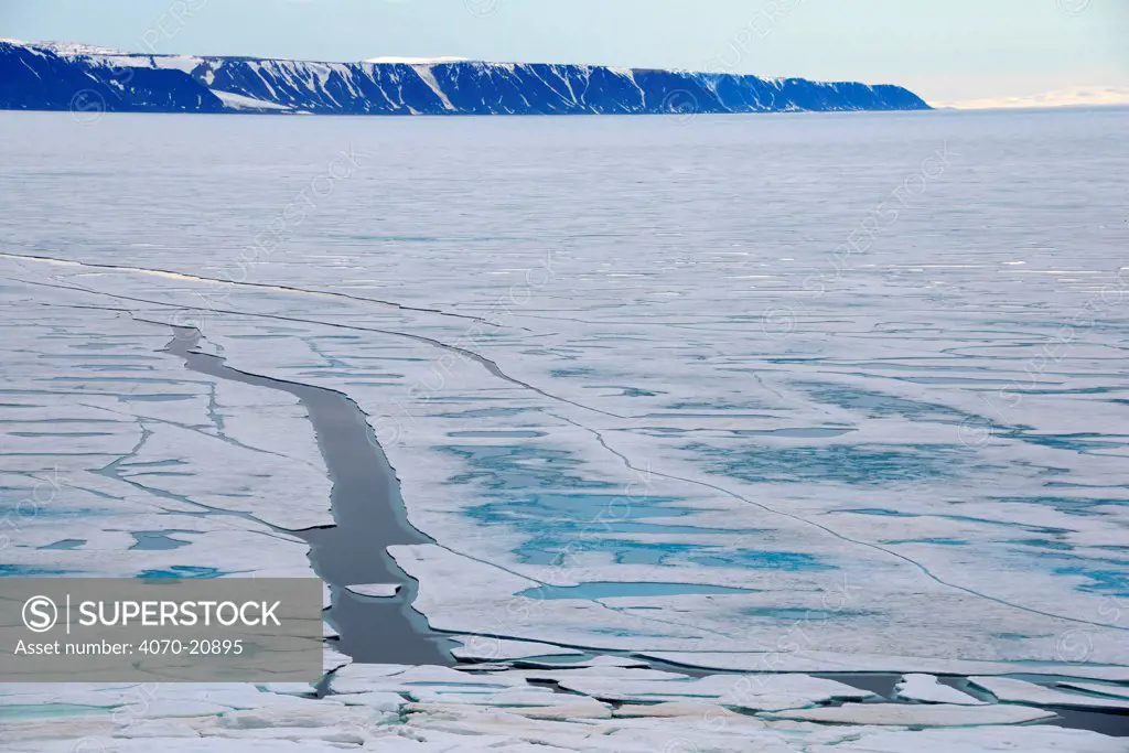 Cracks in the pack ice, Manson Icefield peninsula and Jakeman glacier, Ellesmere Island, Nunavut, Canada, June 2012.