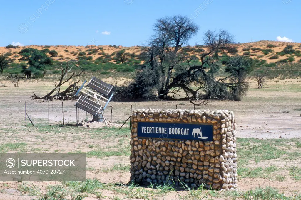 Waterhole, along the Auob River in the Kalahari desert, with pumps powered by solar panels, Kgalagadi Transfrontier Park, South Africa