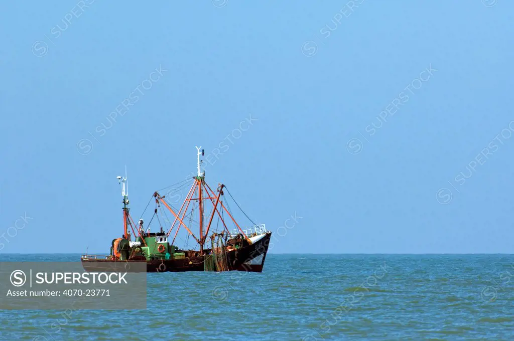 Prawner boat fishing for shrimps along the North Sea coast, Belgium