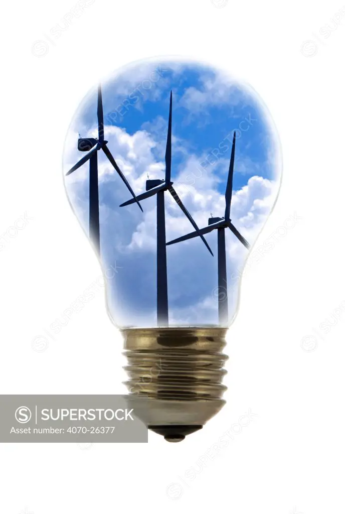 Wind farm turbines against cloudy sky seen inside incandescent lamp / bulb against white background Digital composite
