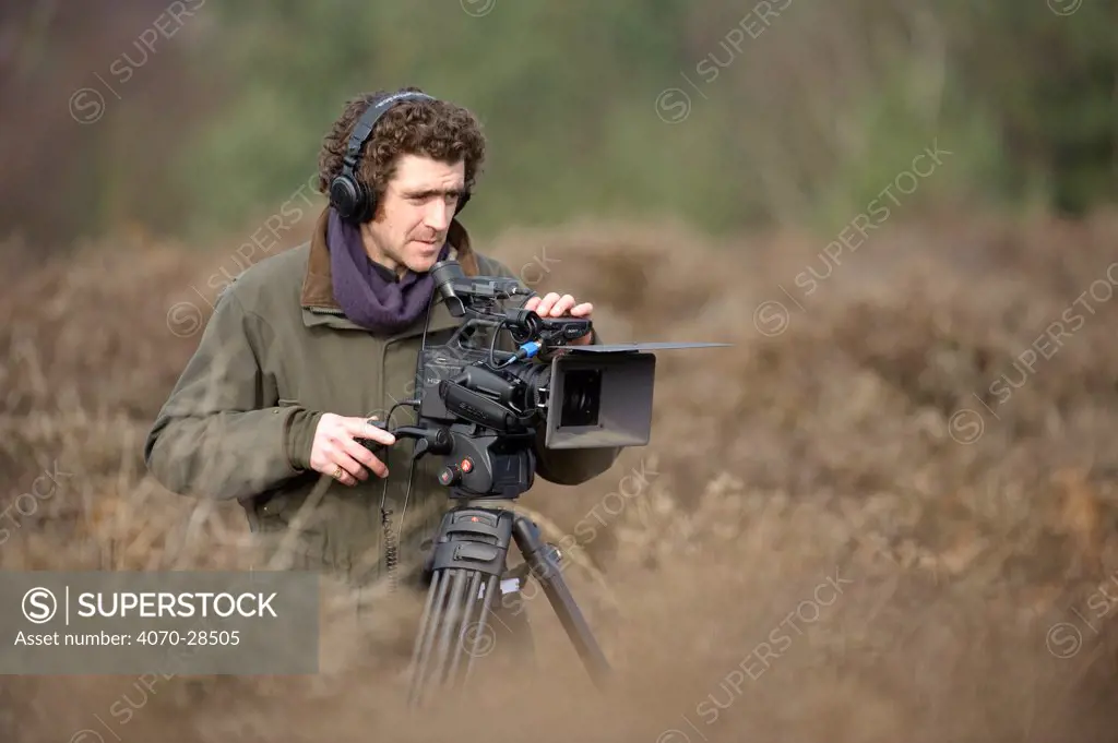 Will Bolton, 2020VISION videographer, filming at Westleton Heath, Minsmere RSPB reserve, Suffolk, UK, February 2011.