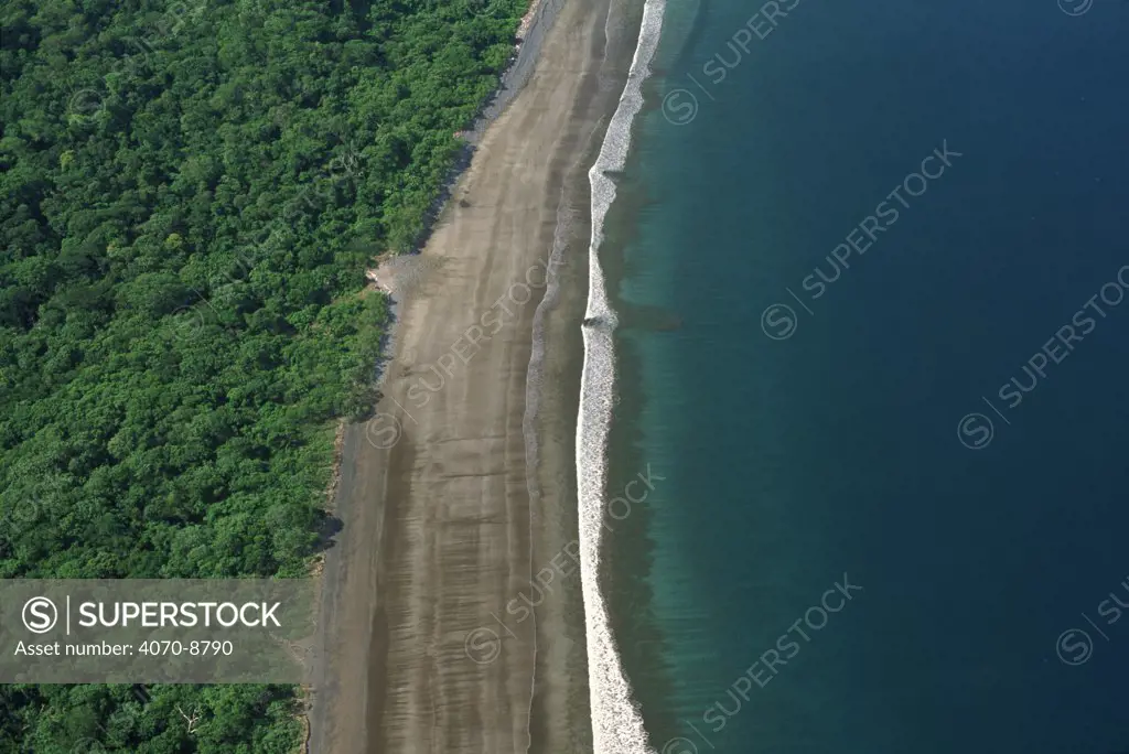 Aerial of Pacific coast tropical dry forest and sea, Santa Rosa NP, Costa Rica, Central America