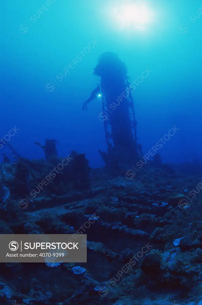 Diver explores funnel on the shipwreck of the Japanese WWII destroyer, 'Shotan Maru', Chuuk / Truk lagoon, Chuuk islands, pacific ocean