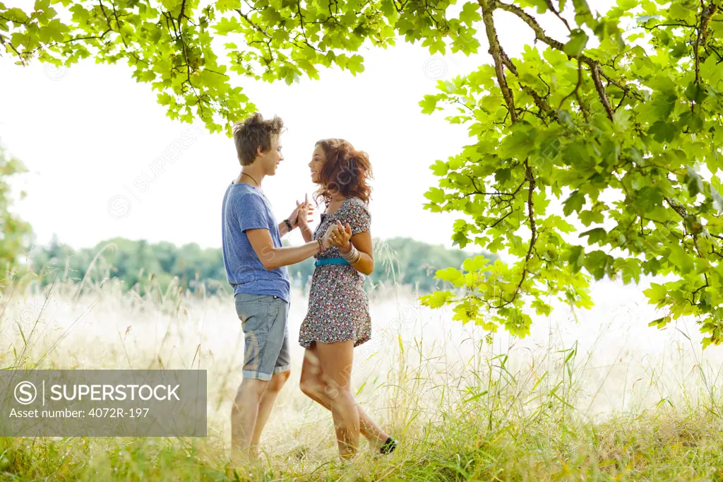 Romantic couple embracing outside