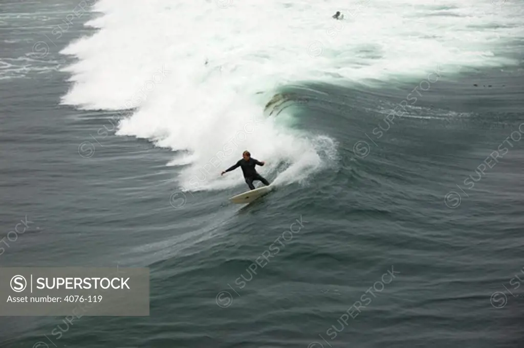 Surfer in the ocean, Steamer Lane, Santa Cruz, California, USA