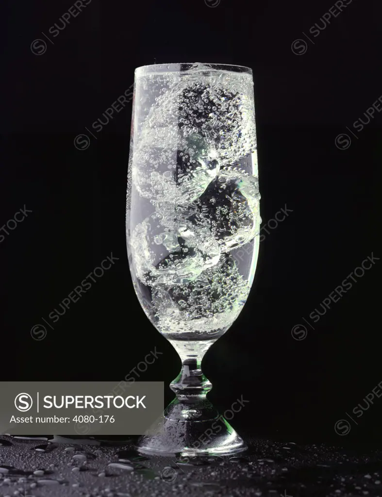 Glass of club soda with ice cubes