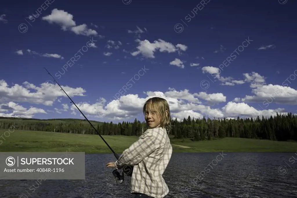 Young Girl Fishing on Shore of  Lake, Oak Creek, Colorado, USA
