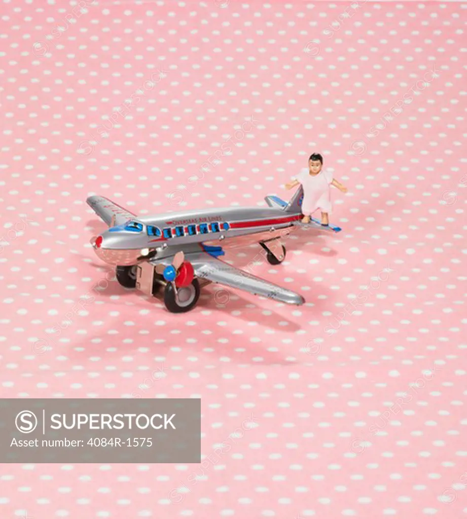 Baby Doll on Toy Airplane