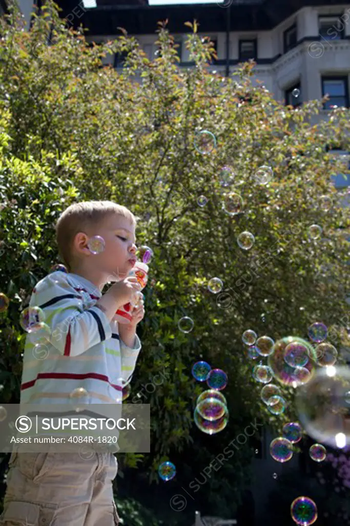 Young Boy Blowing Bubbles