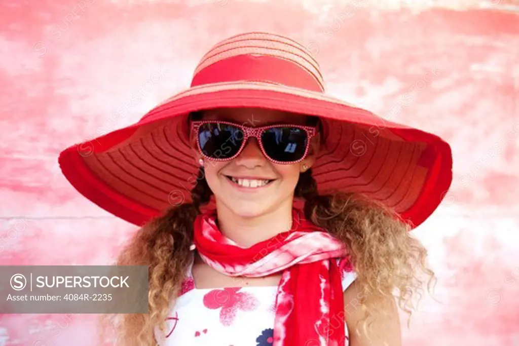 Smiling Girl in Red Floppy Hat and Sunglasses, Close Up