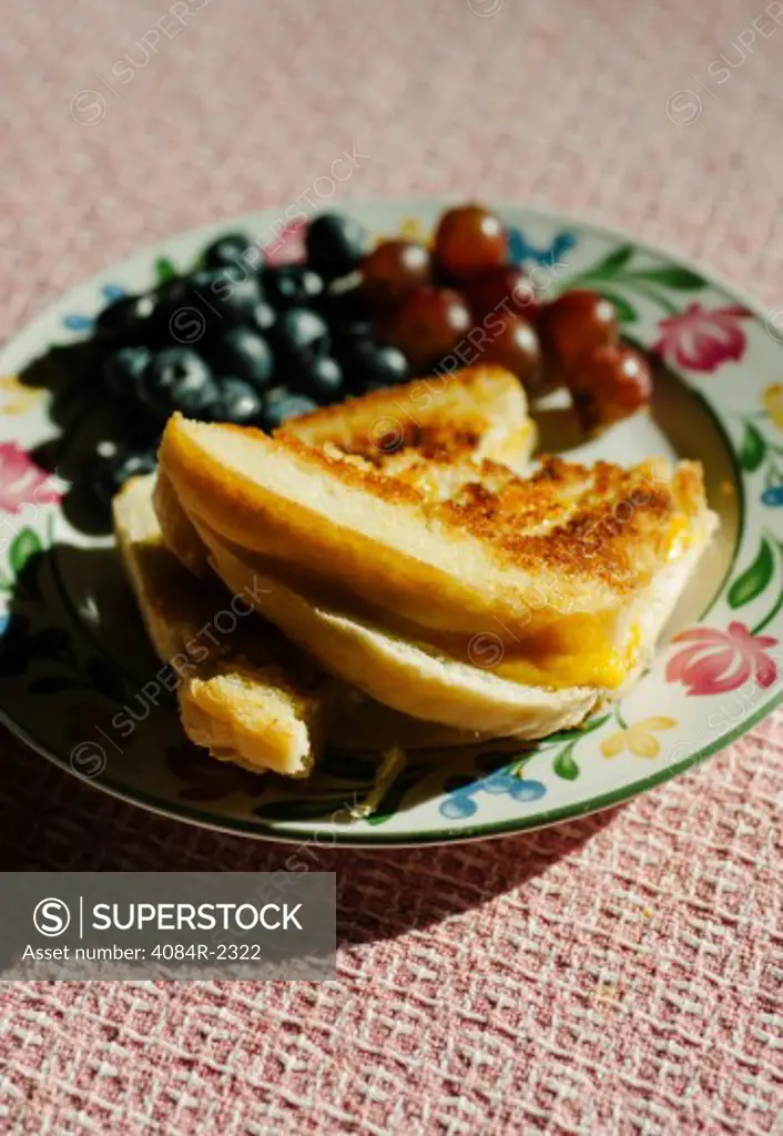 Grilled Sandwich with Blueberries and Grapes on Plate