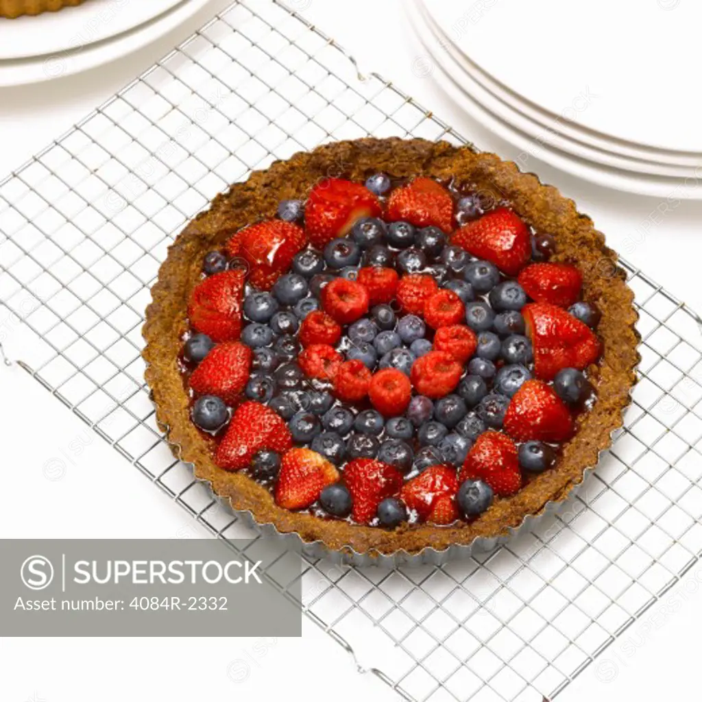 Raspberry, Blueberry & Strawberry Tart on Cooling Rack