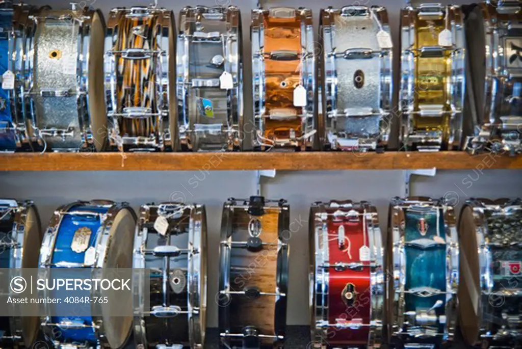 Many Colored Snare Drums on Shelves