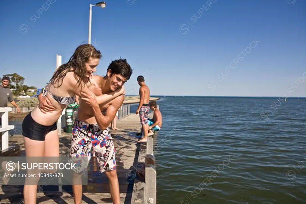 Playful Young Couple on Pier