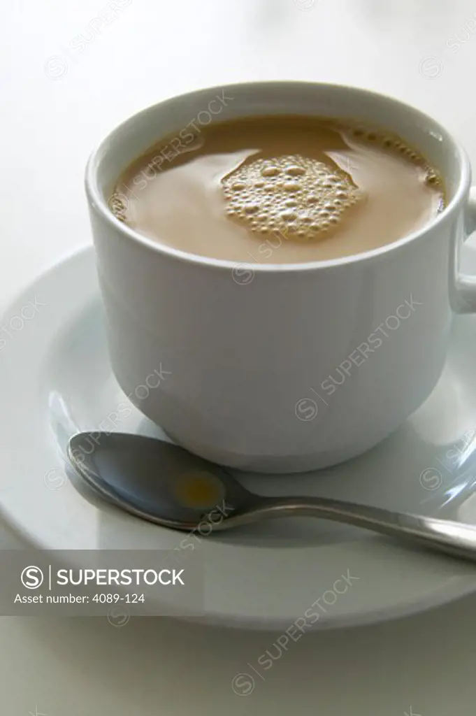 Coffee cup on a saucer with spoon, China