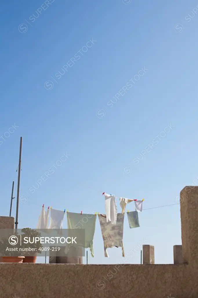 Clothes drying on clotheslines on a roof, Oia, Santorini, Cyclades Islands, Greece