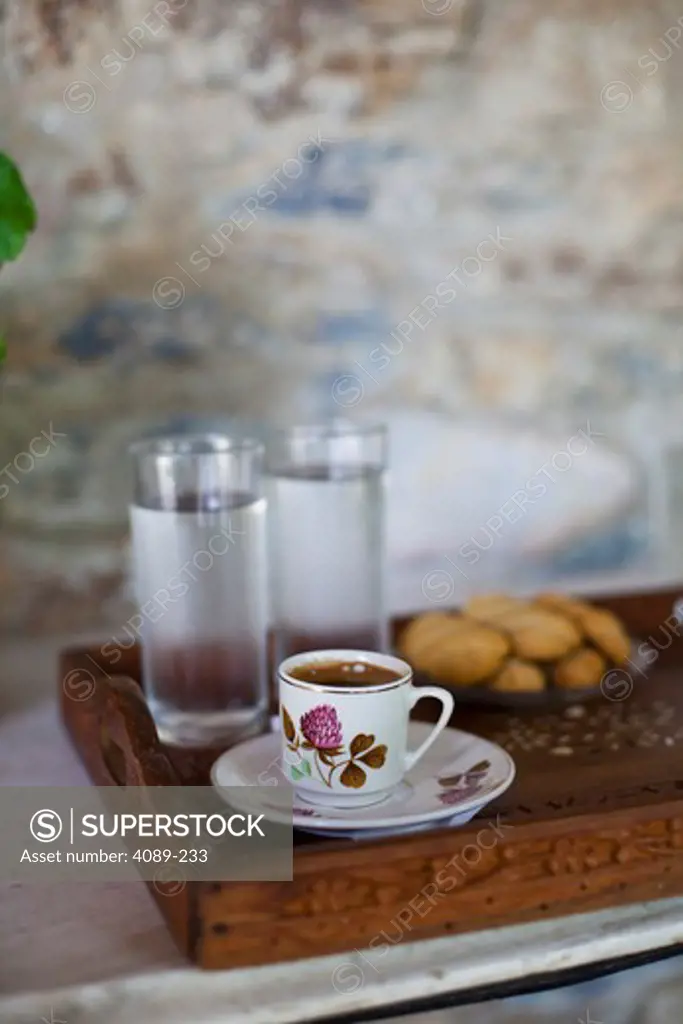 Wooden tray with Greek coffee, water and Kourabieth cookies, Athens, Greece