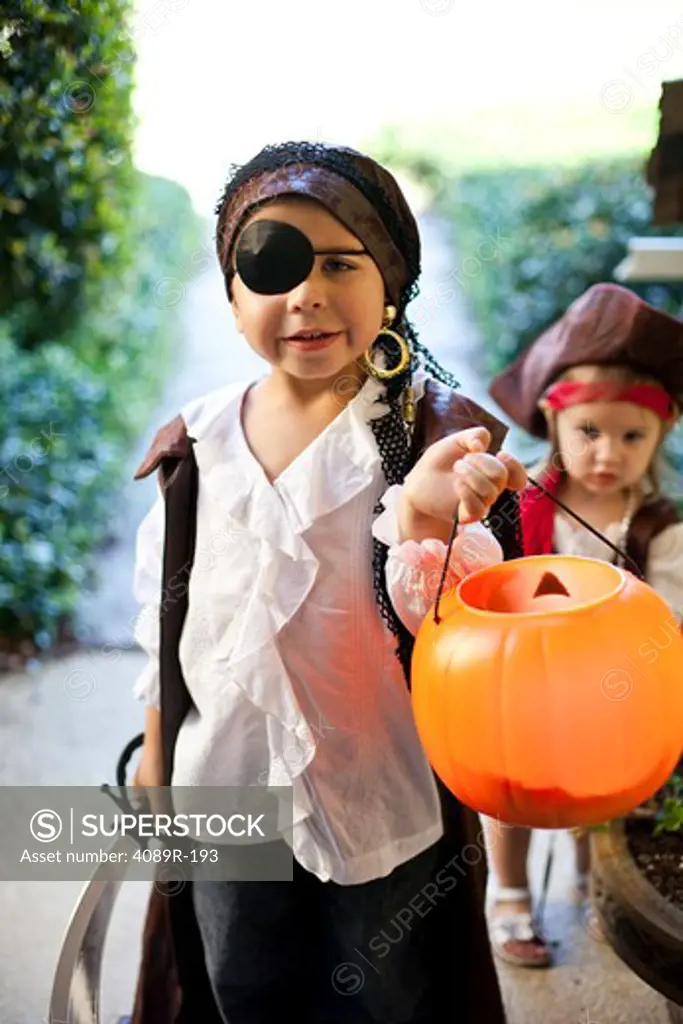 Boy and girl playing Trick Or Treat