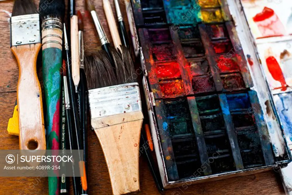 Paintbrushes with a messy palette on a table, Montmartre, Paris, Isle-De-France, France