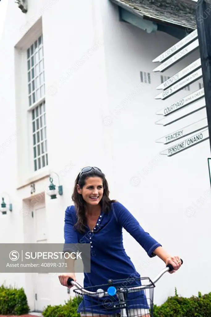 Woman riding bicycle in town
