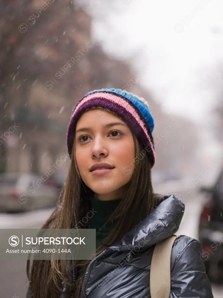 Close-up of a teenage girl in snowing, New York City, New York State, USA