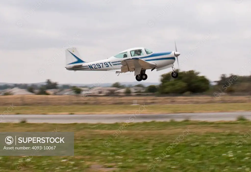 A Meyers 200D departing Flabob airport in Riverside, CA. The Meyers 200 is a single engine piston airplane and was designed by Al Meyers in the late 1950's and built by the Meyers Aircraft Company until 1965. Aero Commander then built them until 1967. It has a cruise speed of 210 mph and is considered one of the fastest airplanes in it's class.