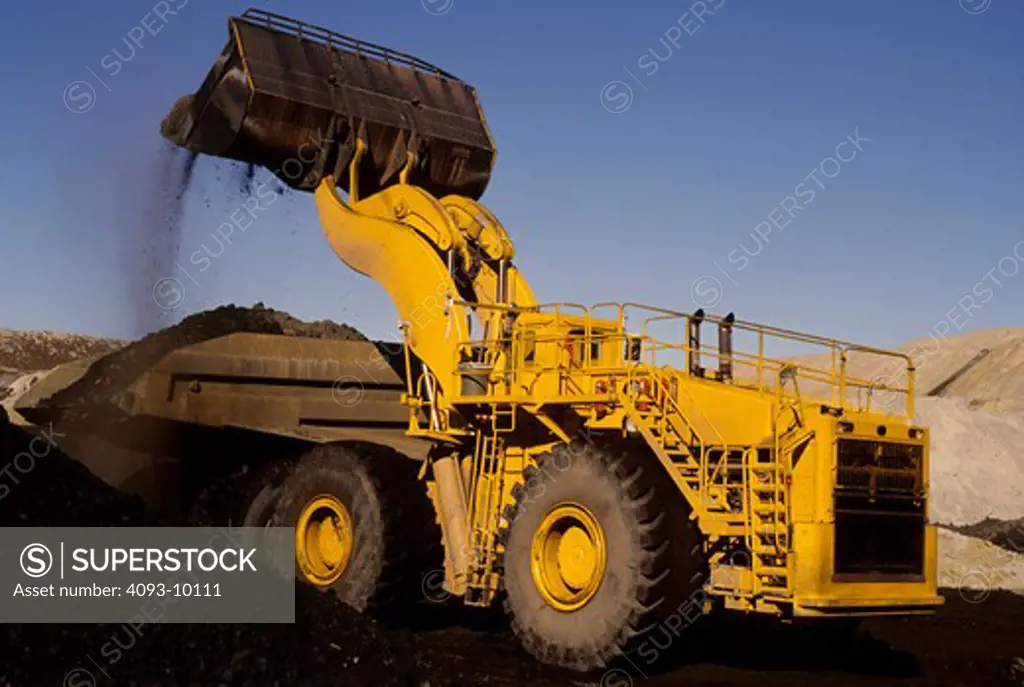 front loader earth mover yellow dump truck quarry