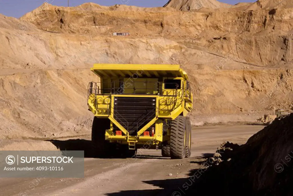 dump truck earth mover yellow quarry mine
