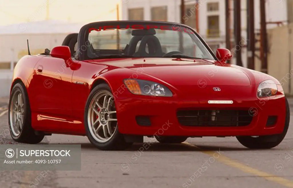 2004 Honda s2000 s-2000 Neuspeed  S2000 features a front-mid-engine, rear wheel drive layout with power being delivered via a Torsen limited slip differential mated to a six-speed manual transmission.  The S2000 comes with an electrically powered cloth top, and an OEM hardtop is also available.  The 2004 model introduced newly designed 17 wheels and Bridgestone RE-050 tires along with a retuned suspension that reduced the car's tendency to oversteer. The spring rates and shock absorber damping w