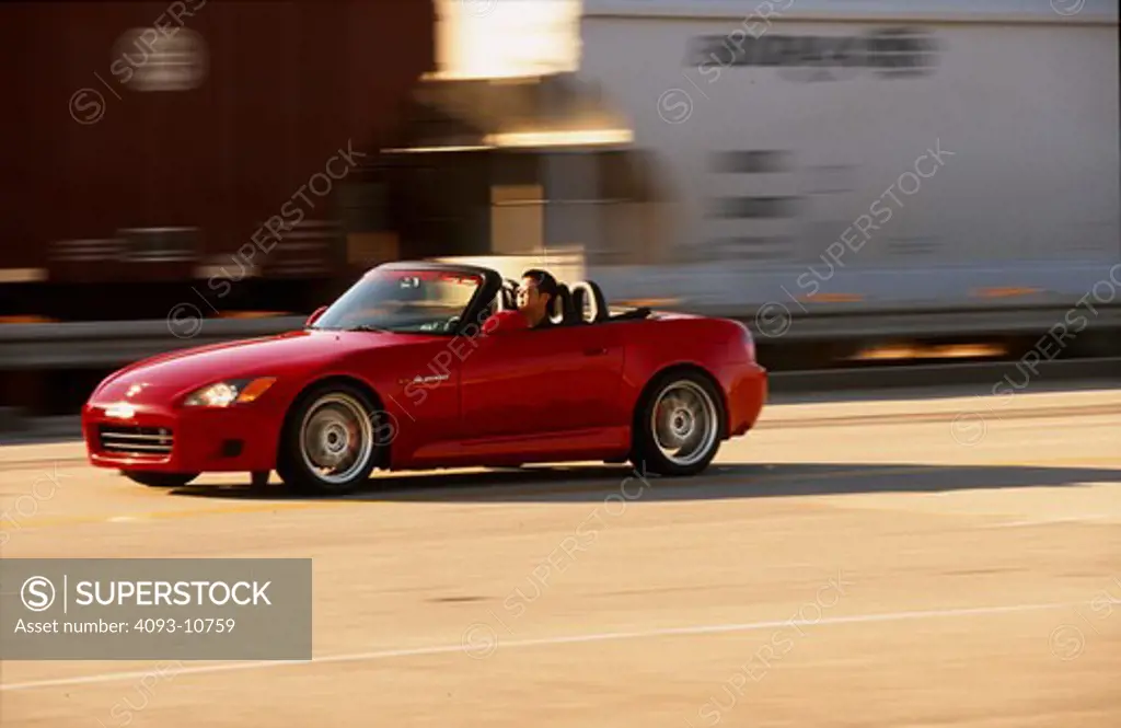 2004 Honda s2000 s-2000 Neuspeed  S2000 features a front-mid-engine, rear wheel drive layout with power being delivered via a Torsen limited slip differential mated to a six-speed manual transmission.  The S2000 comes with an electrically powered cloth top, and an OEM hardtop is also available.  The 2004 model introduced newly designed 17 wheels and Bridgestone RE-050 tires along with a retuned suspension that reduced the car's tendency to oversteer. The spring rates and shock absorber damping w