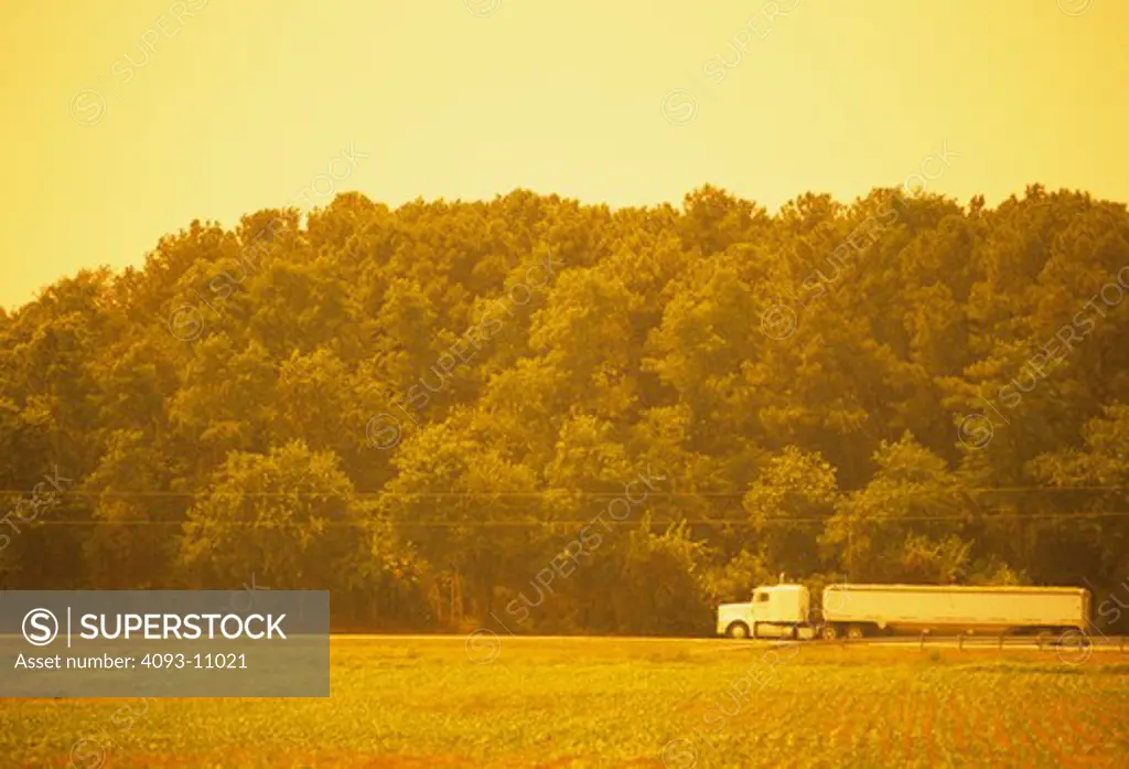 big rig truck diesel farm field country bring sun yellow gold