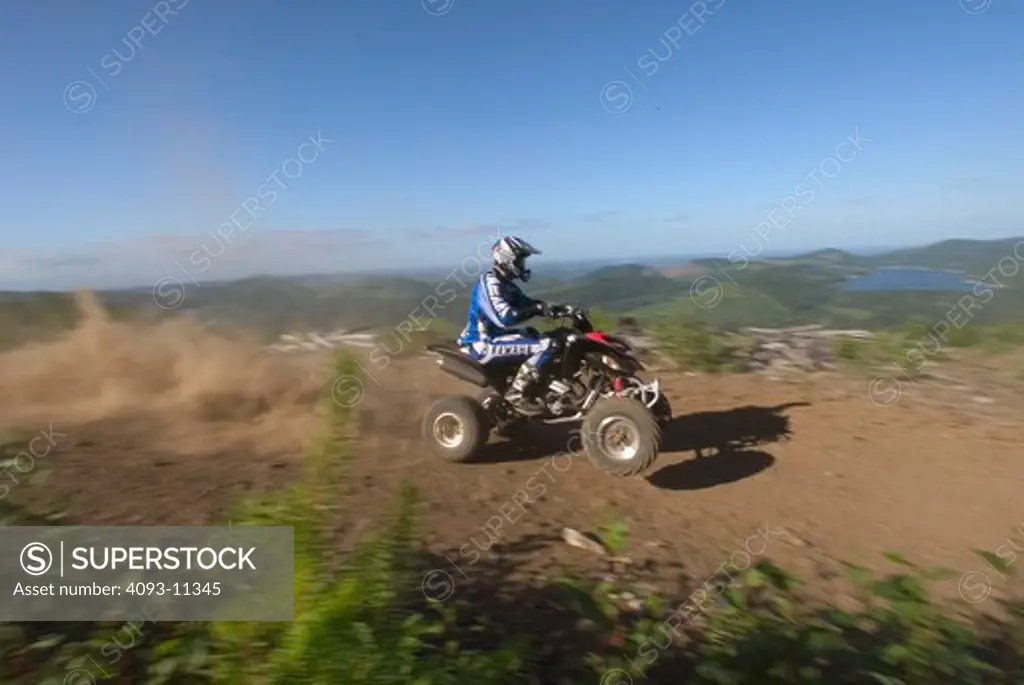 Yamaha Raptor ATV quad 2003 blue red rider trail dust dusty jumping