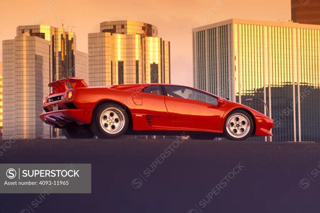 Lamborghini 1994 Diablo VT red profile rear 3/4 beauty asphalt pavement buildings 1990s street city
