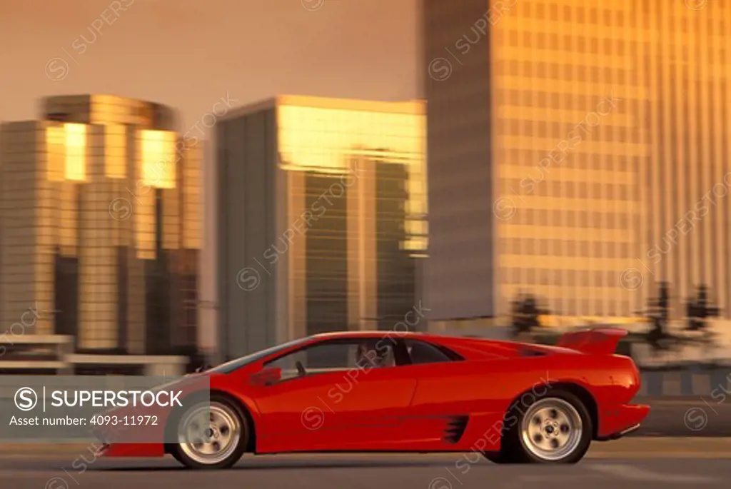 Lamborghini 1994 Diablo VT red profile blur man buildings 1990s street city