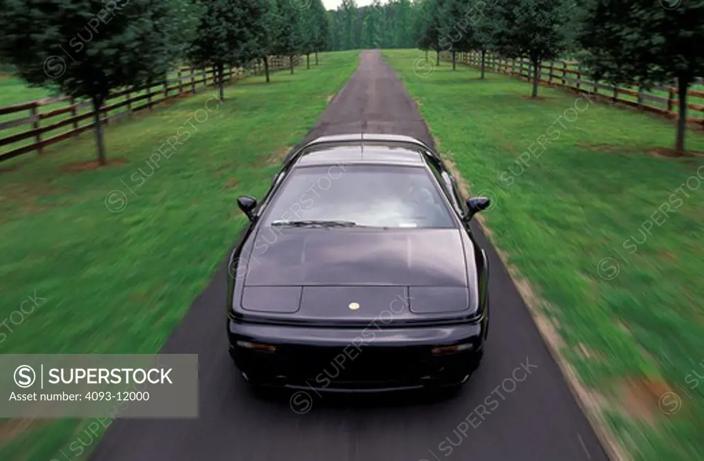 Lotus Esprit V8 1997 black blacktop head on 1990s street