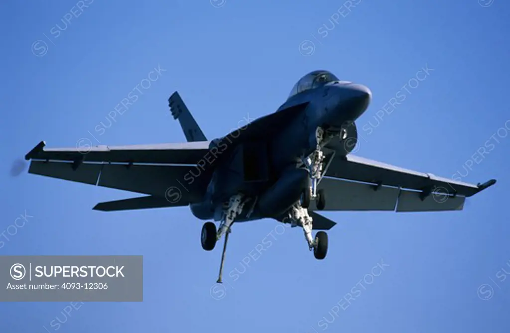 low angle Military Jets Fixed Wing Boeing Aviat Airplanes FA-18 Hornet grey approach arrestor hook landing gear