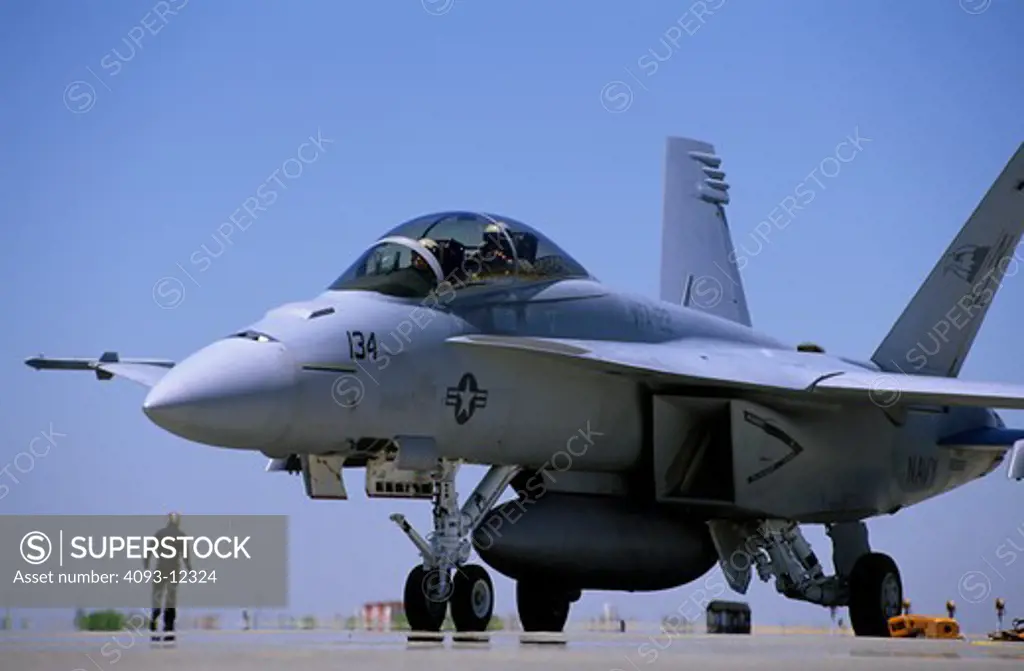 Military Jets Fixed Wing Boeing Aviat Airplanes FA-18 Hornet grey ground crew runway