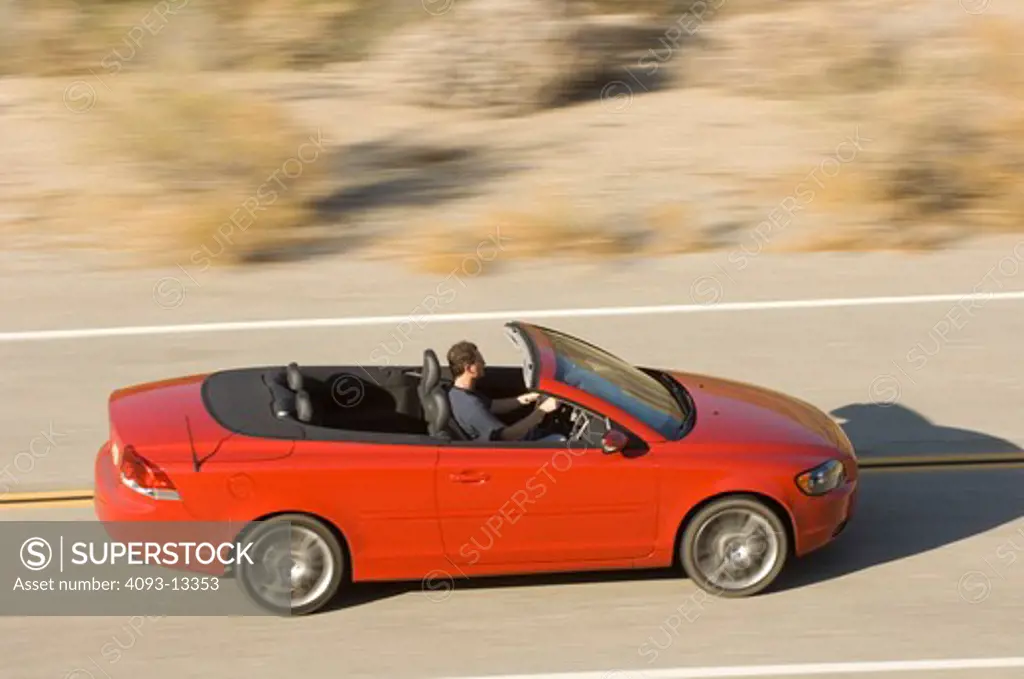 2007 red Volvo C70 retractable hardtop. Considered both a Convertible and a Coupe.