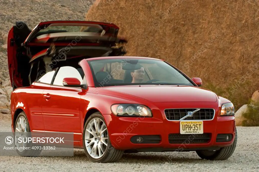 2007 red Volvo C70 with retractable hardtop. Considered both a Convertible and a Coupe.