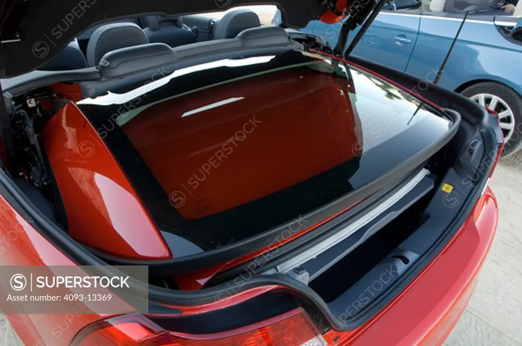 2007 red Volvo C70 with retractable hardtop. Considered both a Convertible and a Coupe.