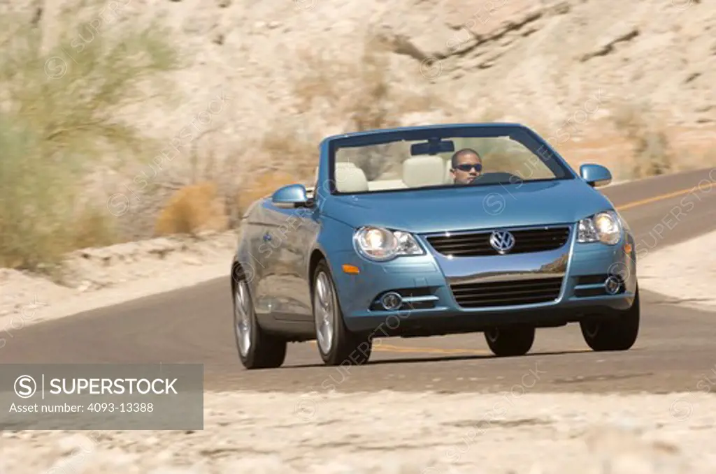 2007 light blue Volkswagen EOS with retractable hardtop. Considered both a Convertible and a Coupe.