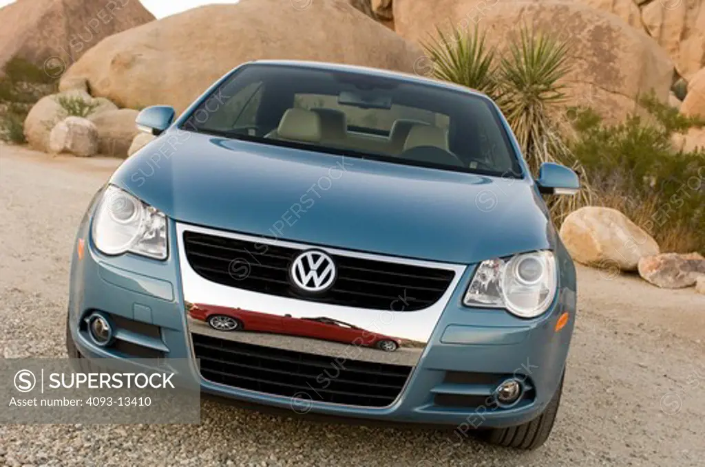 2007 light blue Volkswagen EOS with retractable hardtop. Considered both a Convertible and a Coupe.