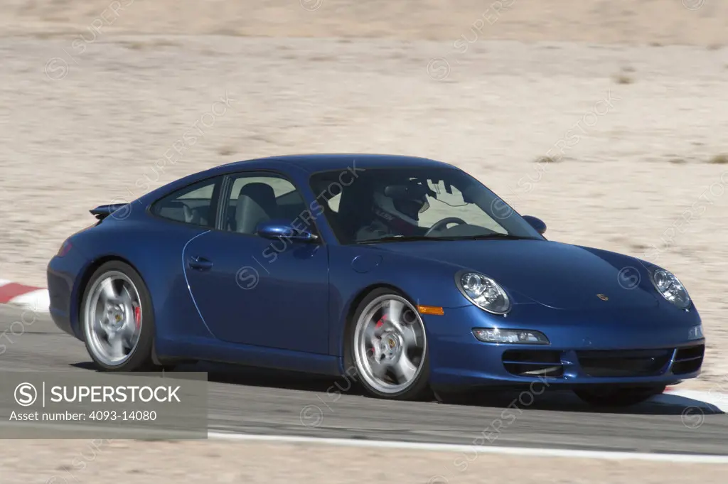 Porsche 911 Carrera S on race track, side view