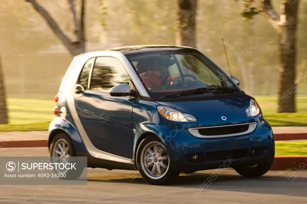 Smart ForTwo Passion Cabriolet driving along road, side view